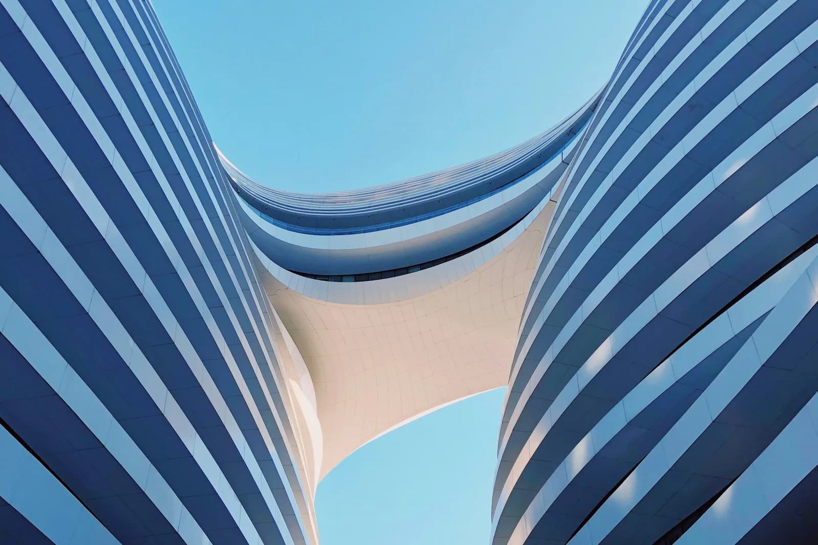 Curved glass and white balcony architecture